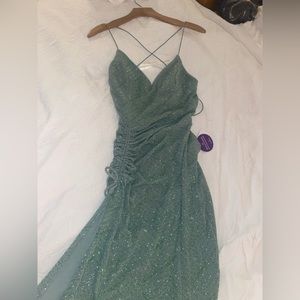 Green backless prom dress with a slit